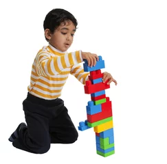 Fototapete Lego Toddler Making a tall Building with Blocks  © mitgirl