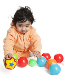 Fototapeta na wymiar Cute Baby Girl Playing with Colorful Balls, On White