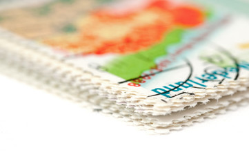 closeup of stamp perforations on white