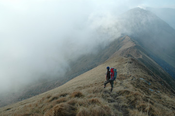 Lonely trekking man in Rodnei mountains, Romania