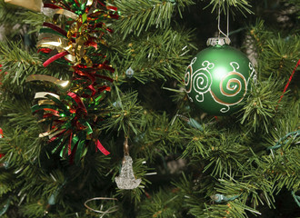 Green Ball and Glass Ornament on Christmas Tree