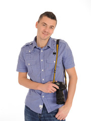 A smiling professional male photographer isolated on white backg