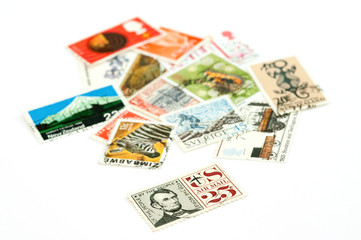 mail stamps from various countries on white