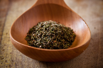 Herbs on wooden spoon