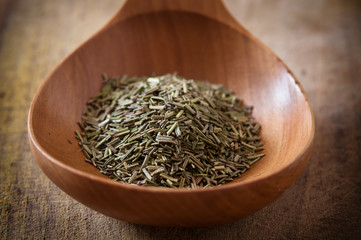 Rosemary on wooden spoon
