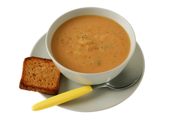 vegetable soup with toast and spoon