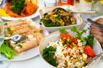 Plates with salads on dinner table, selective focus