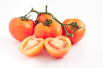Bunch of vine tomatoes on white