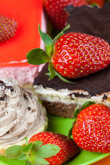 cake and strawberries lying on the orange fabric