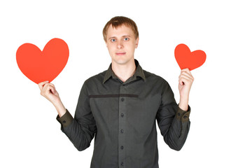 young caucasian man holding red paper hearts isolated