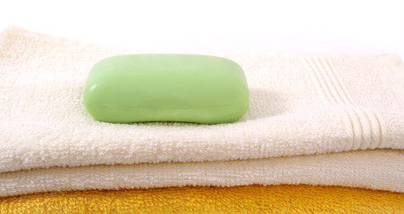 Fototapeta na wymiar Green soap and towels.