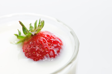 Milk. A strawberry.