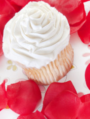 Rose petals around cupcake