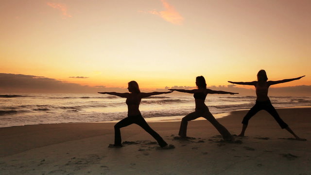 Yoga on the Beach at Sunrise