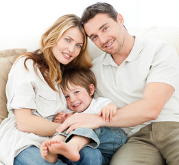 Happy family on their sofa