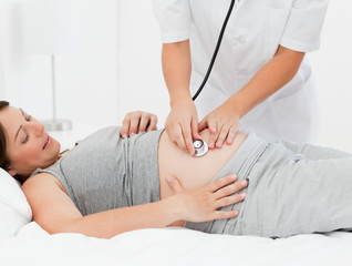 Pregnant woman with a nurse