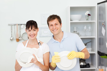 Lovers washing dishes together