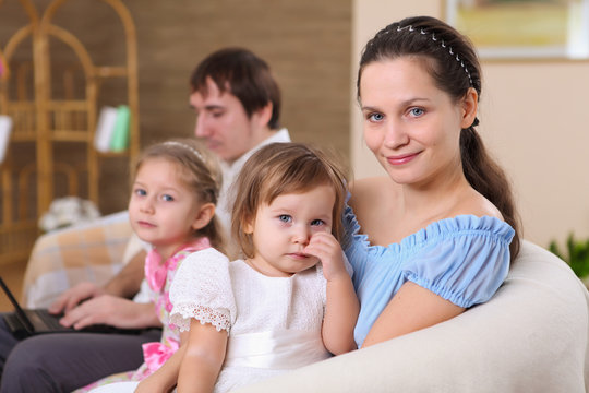 young family at home with a daughter