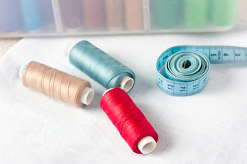 Sewing supplies - scissors, thread on fabric