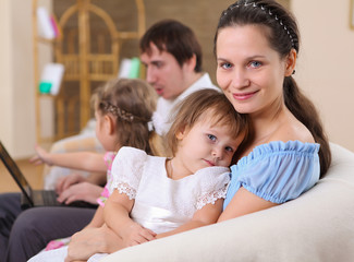 young family at home with a daughter