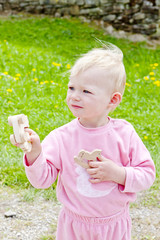 little girl playing with wooden toys