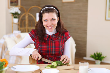 a young girl cooking at home