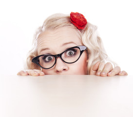 Girl hiding behind a desk