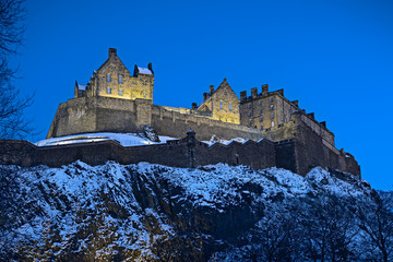 Edinburgh Castle, Scotland, UK, illuminated at dusk in winter