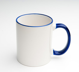 white mug with blue handle