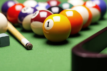 Billiard balls, cue on green table!