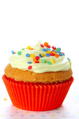 Cupcake decorated with sugar sprinkles  on white isolated backgr