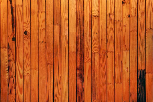 matched natural color pine plank with knots background closeup