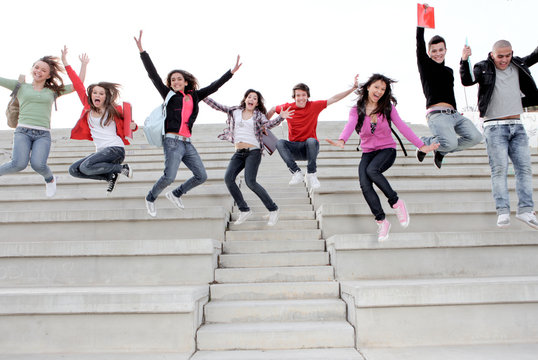 group of school kids jumping