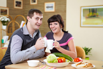 Obraz na płótnie Canvas couple at home having meal