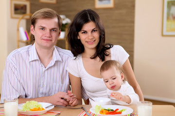 young family at home having meal