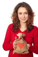 Young Woman holding a gift bag with a red heart on it