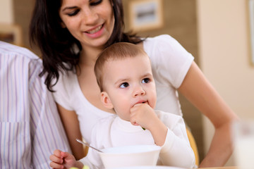 young family at home having meal