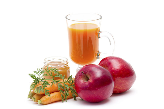 glass of fresh carrots juice with apple and honey