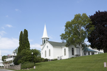 Fototapeta na wymiar White church on a sunny summer day.