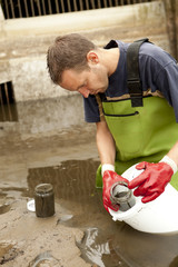 Taking samples of the soil and groundwater, environmental resear