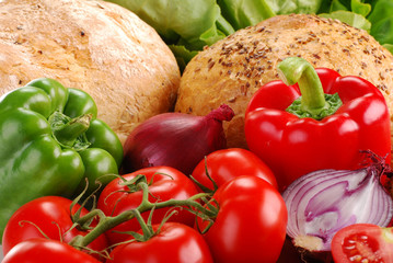 Composition with bread and vegetables on breadboard