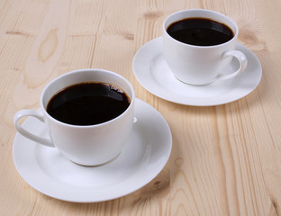 Coffee cups on wood