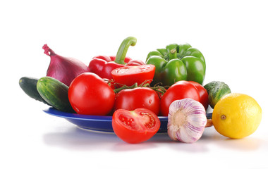 Composition with raw vegetables isolated on white