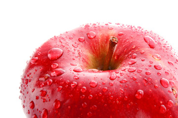 Red apple closeup with waterdrops isolated on white
