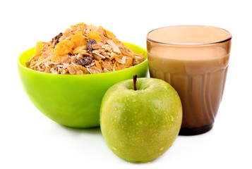 Muesli, apple and milk isolated on white