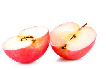 Red apple and half of apple isolated on white