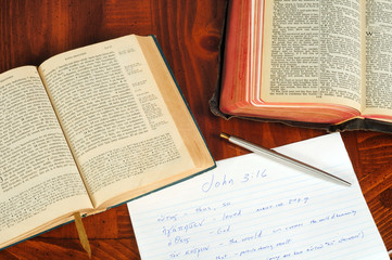 Greek and English Bibles open to John with study notes