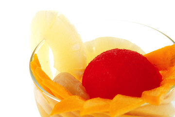 Obraz na płótnie Canvas tropical fruits within small glass cup