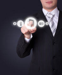 Man pressing media player button
