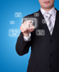 Man pressing shopping cart icon